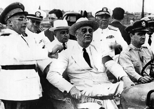 Franklin D. Roosevelt (in the front seat)